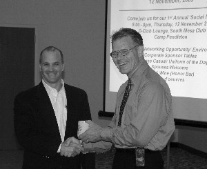 Mark Witzel (r), chapter president, recognizes Gabriel A. Raia Jr., chief executive officer for CS-Solutions, a new corporate member, at the chapter's October meeting.